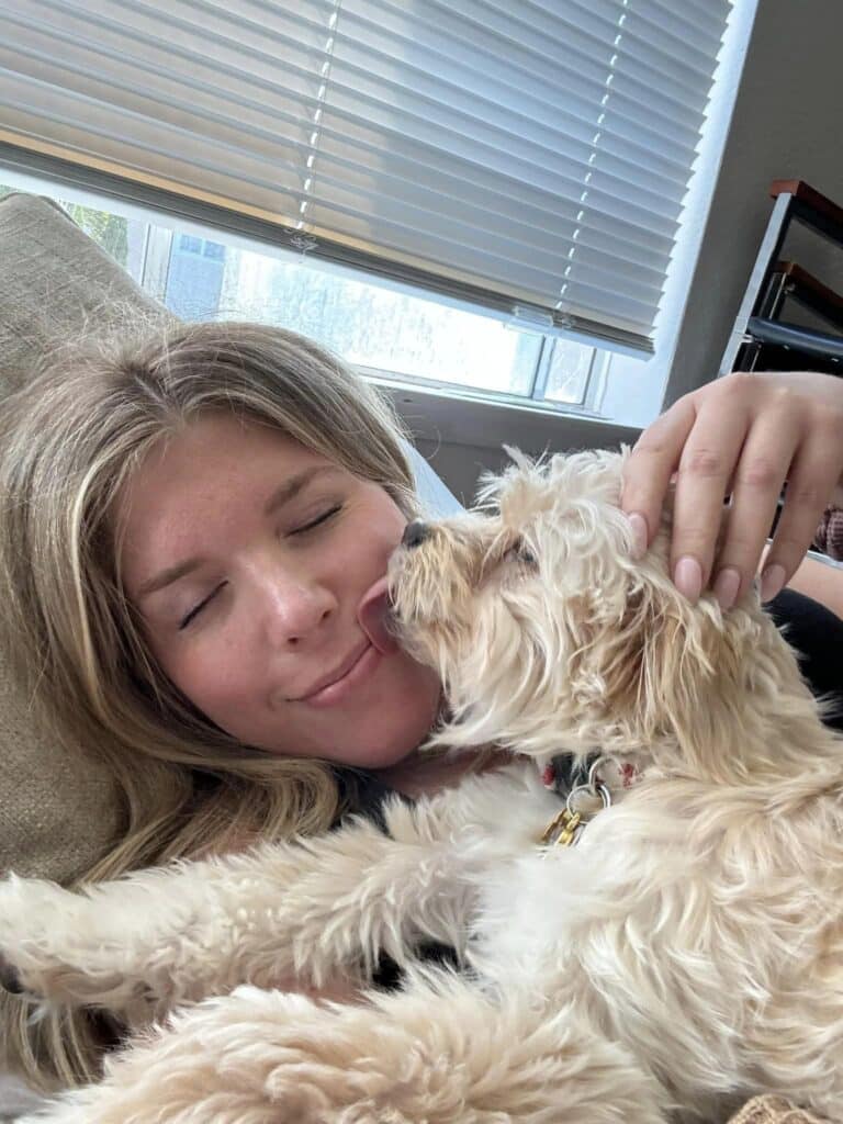 dog licking womans face